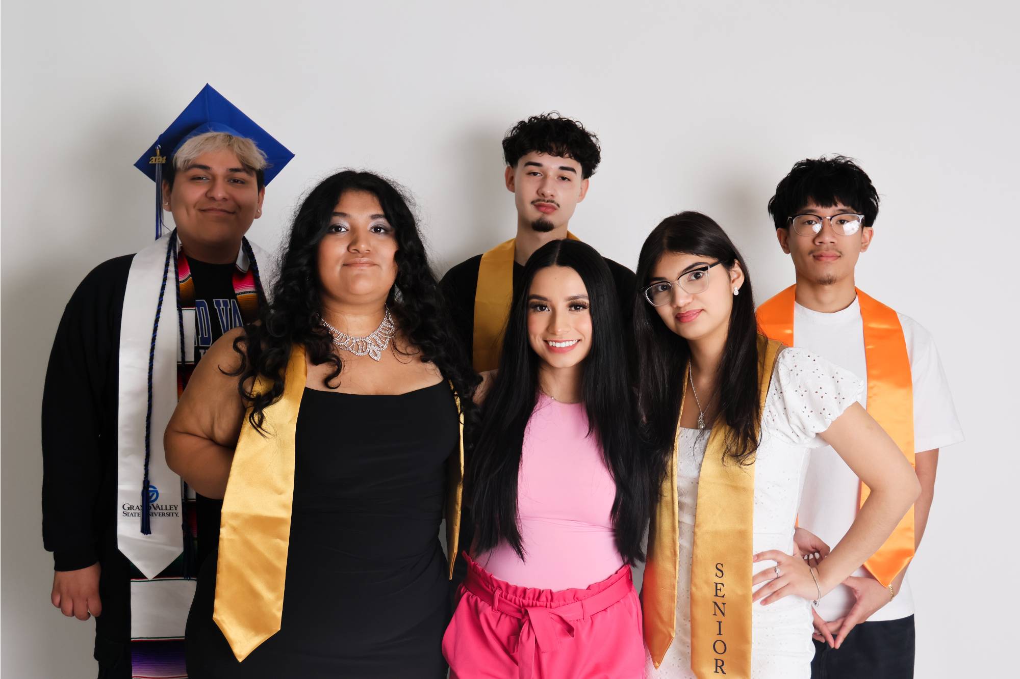 students with graduation gear